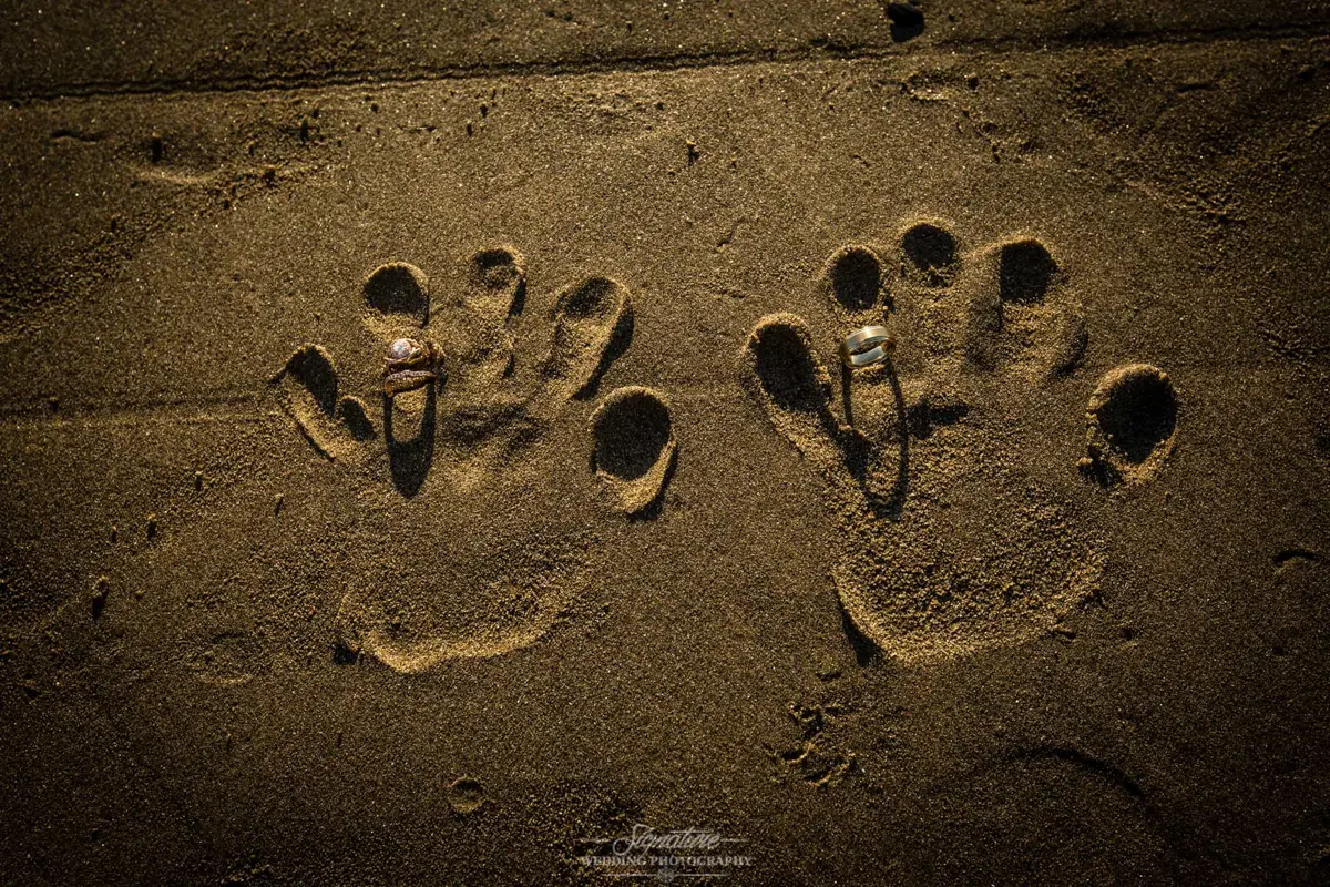 hand prints in the sand