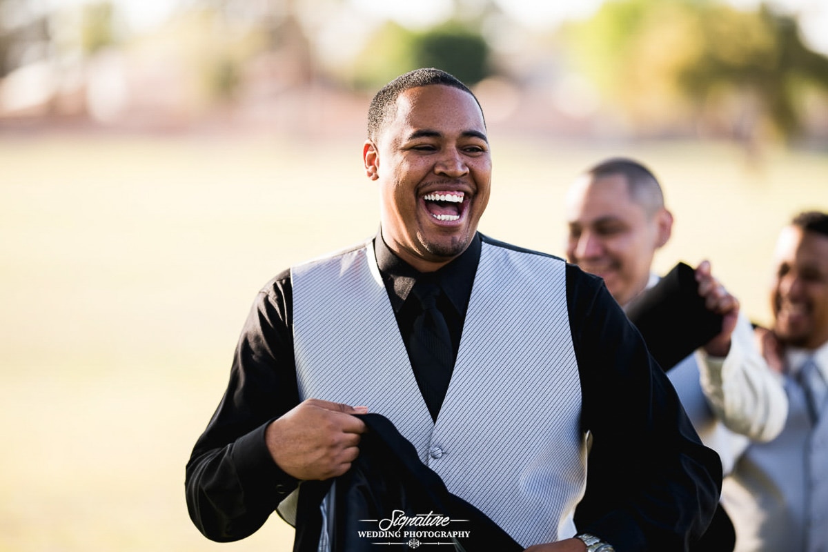 Groom laughing candid