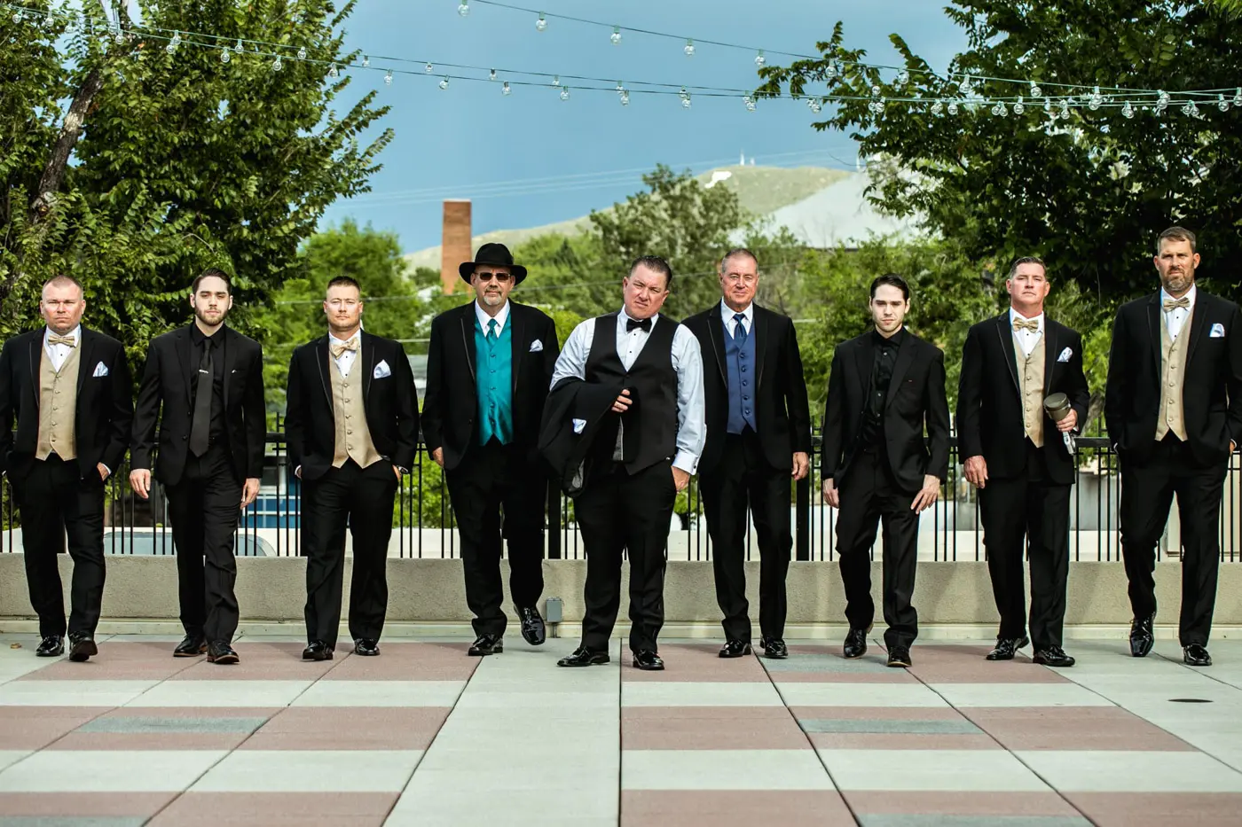 Groom walking with groomsmen outside