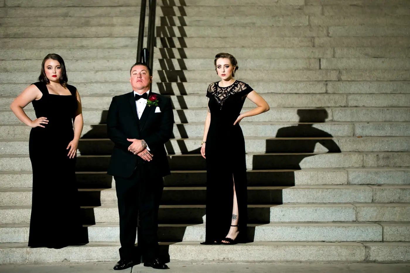 Groom on stairs with bridesmaids