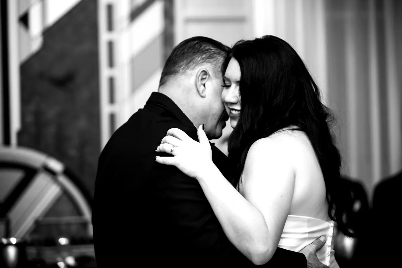 Bride and groom dancing black and white