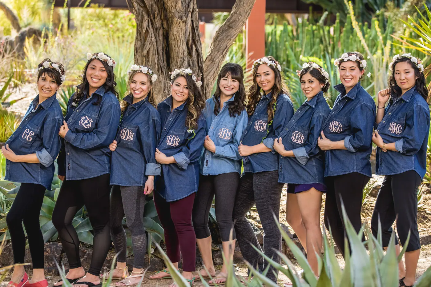 Bride and bridesmaids in denim jackets outside