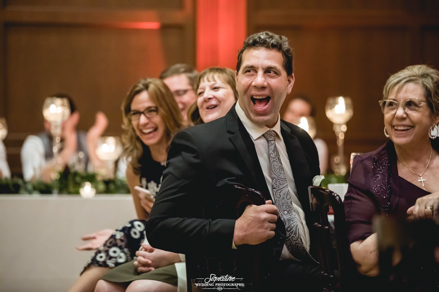 Wedding guests laughing candid