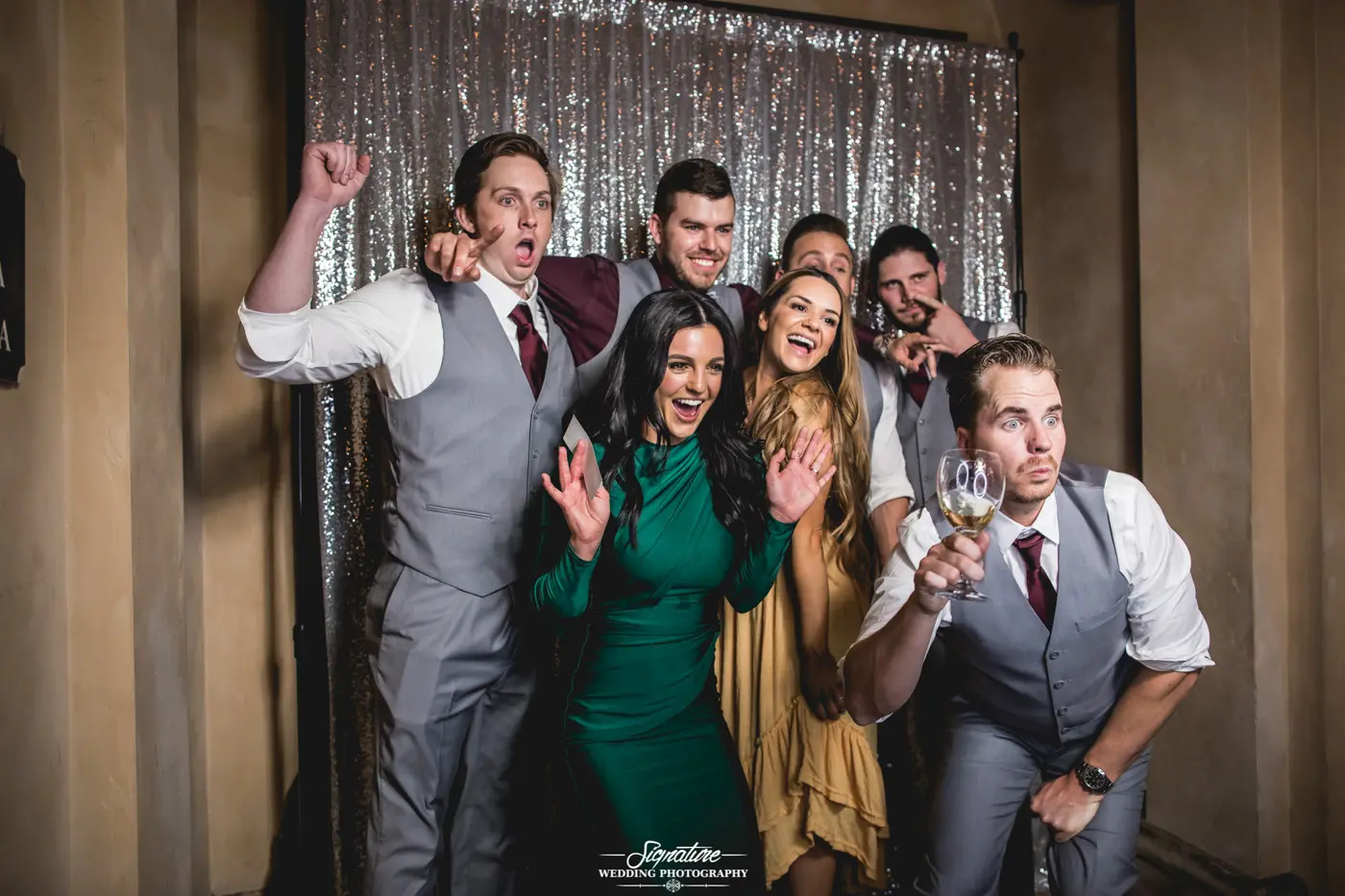 Wedding guests posing for photobooth