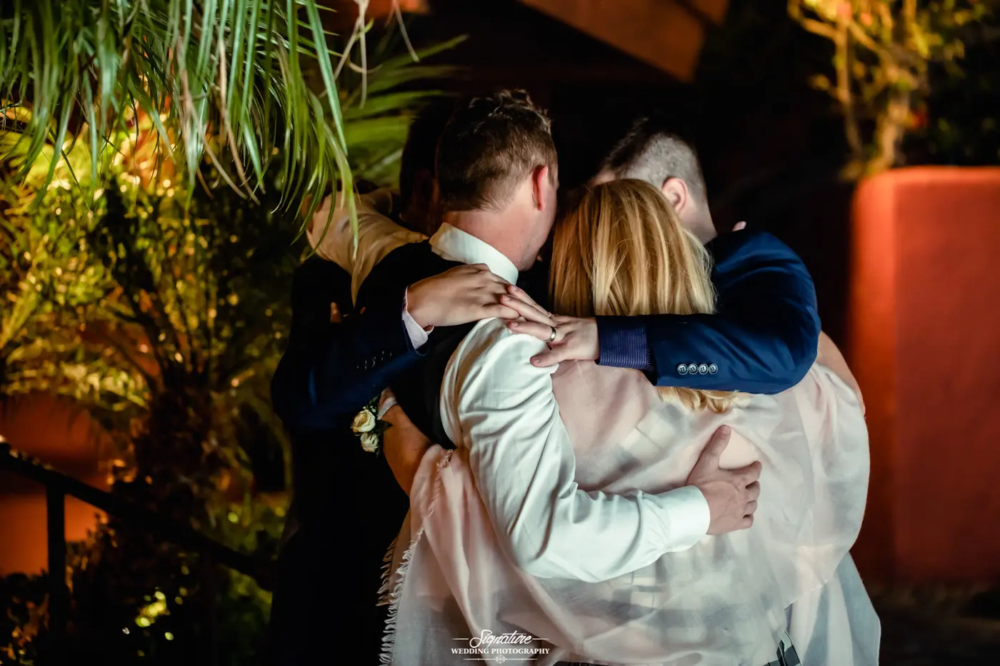 Wedding party huddled together