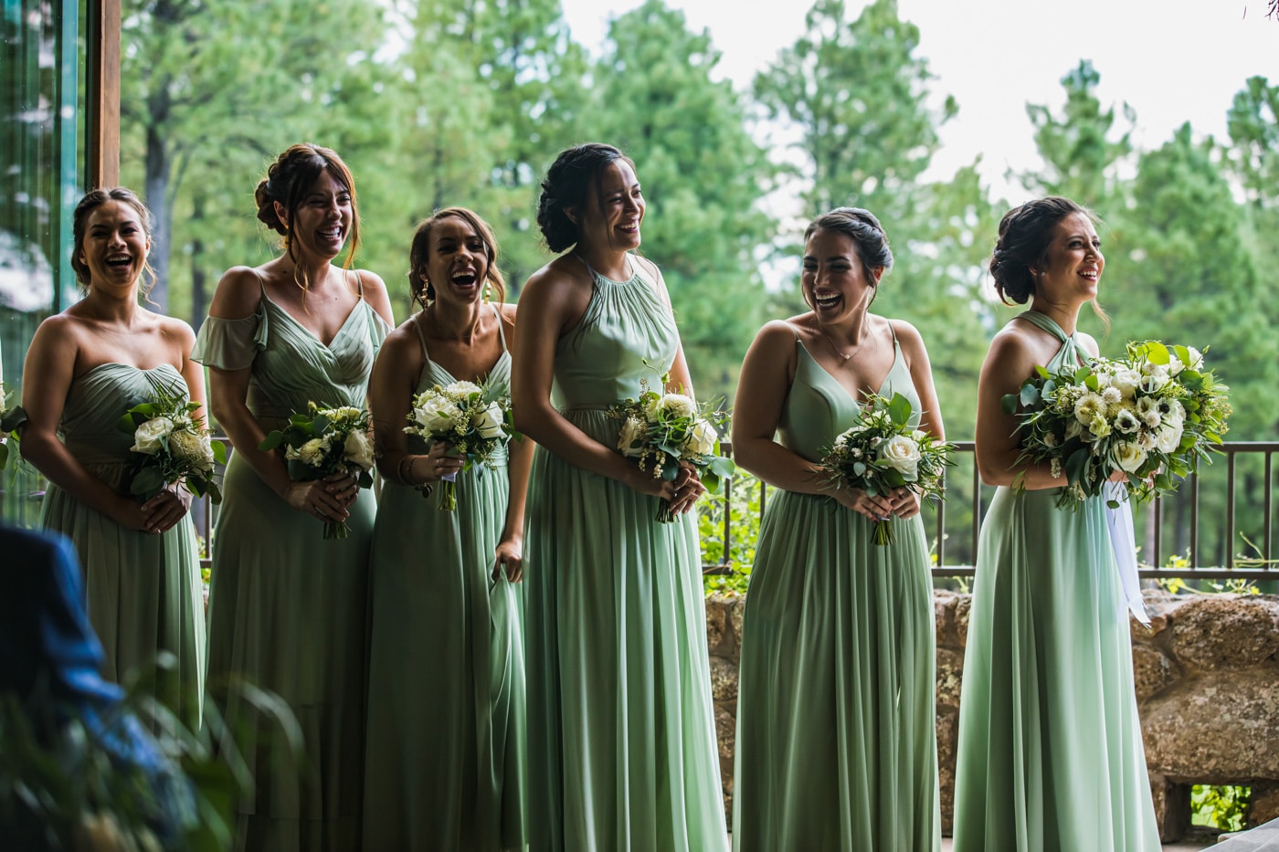 Bridesmaids smiling during ceremony candid