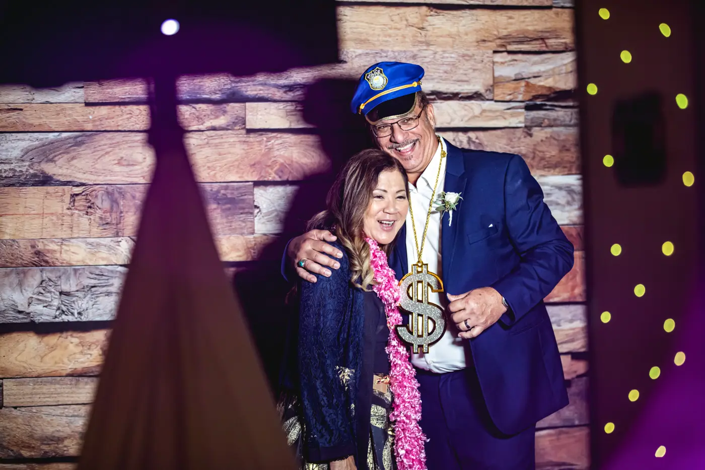 Wedding guests with props for photo booth
