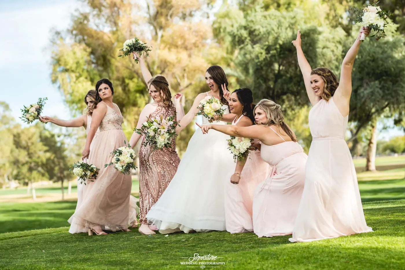 Bride and bridesmaids funny pose side shot