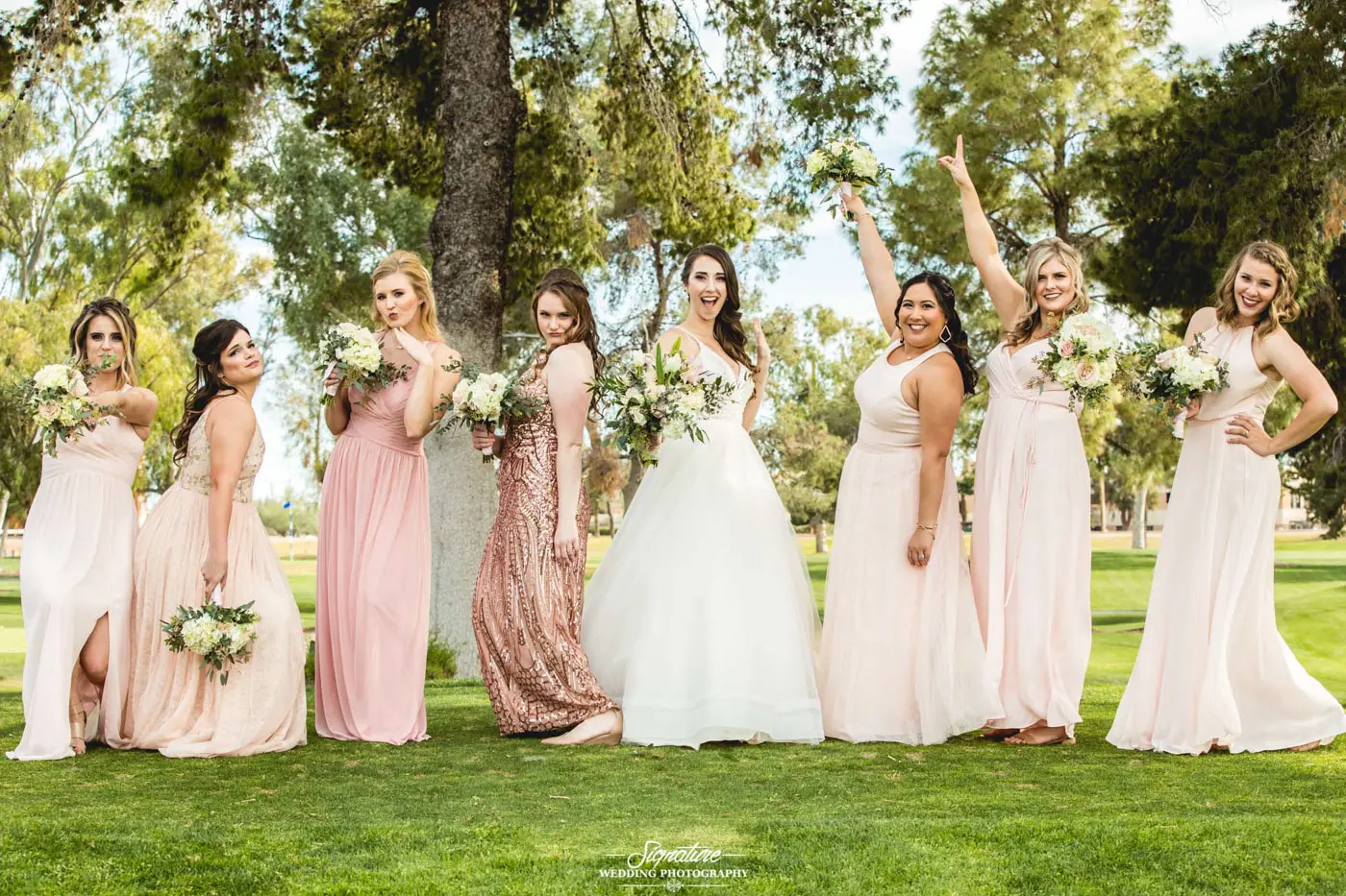 Bride and bridesmaids in fun pose