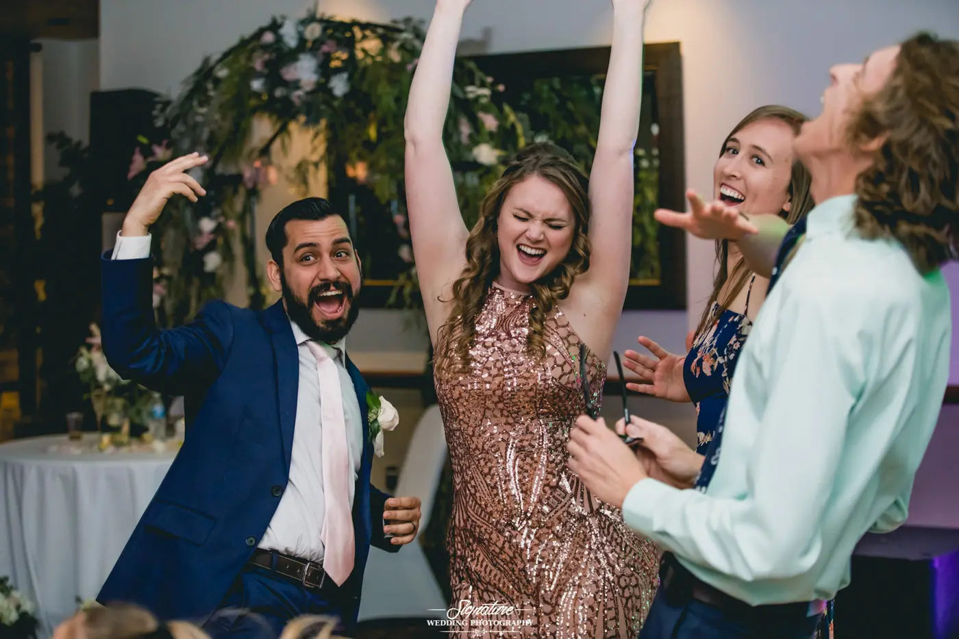 Wedding guests dancing candid