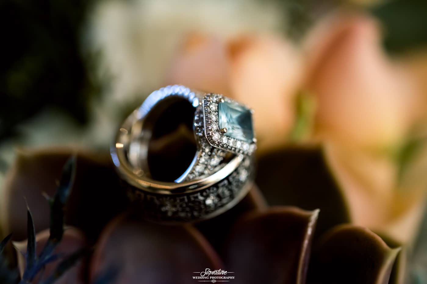 Close up shot of wedding rings on flowers