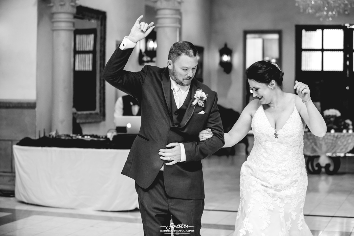Bride and groom fun dancing black and white