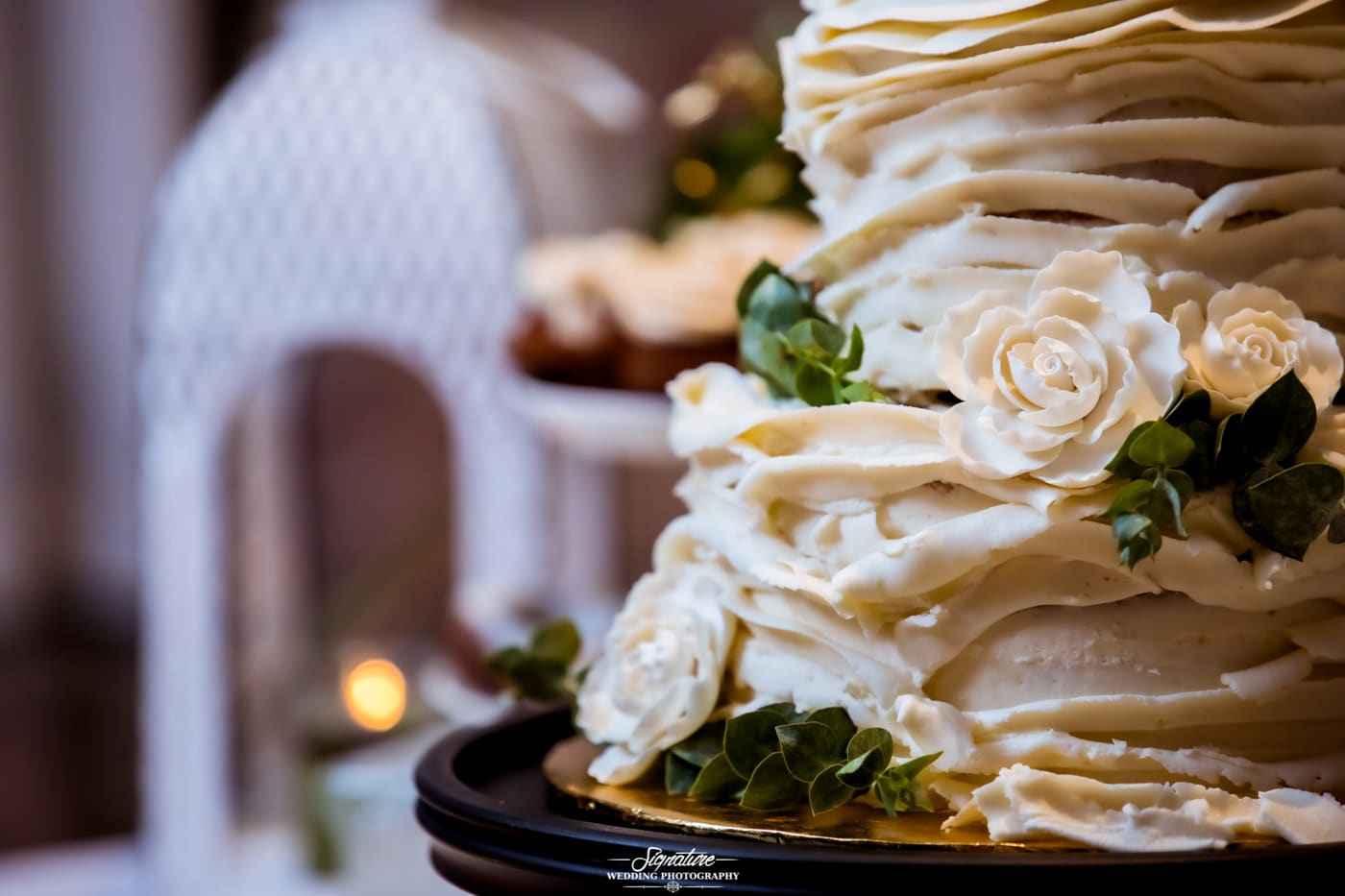 Close up of wedding cake with flowers