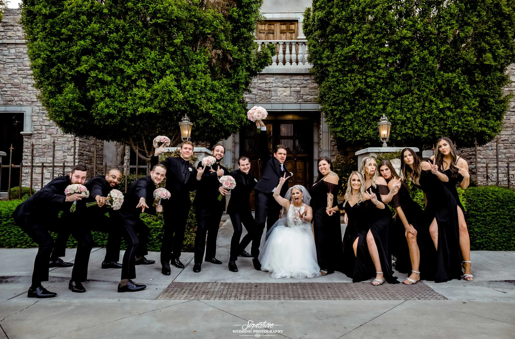 Wedding party funny pose outside