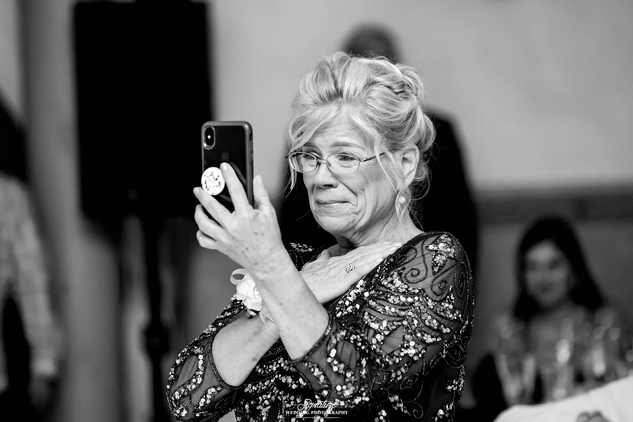 Mother recording reception on phone