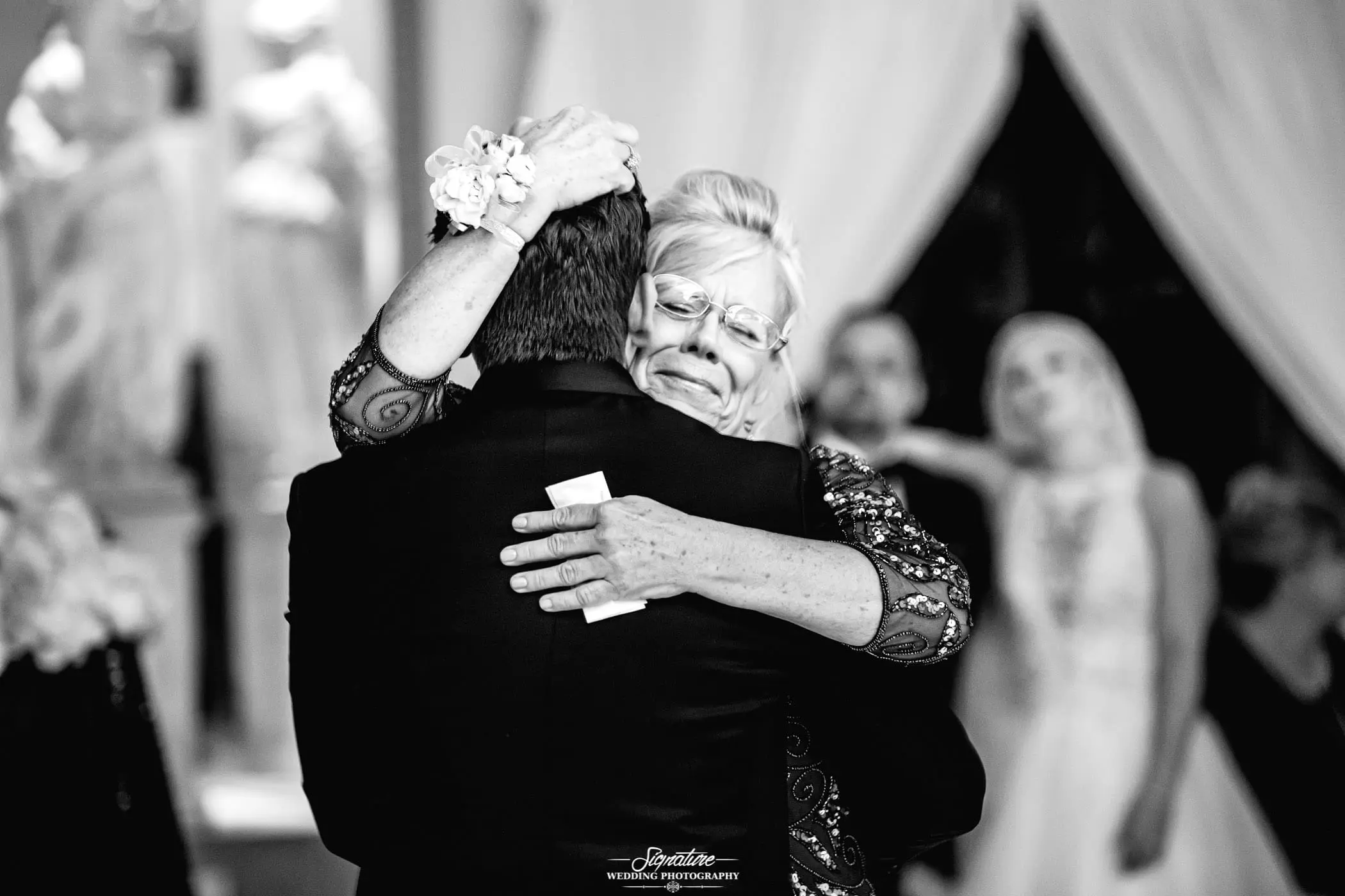 Mother and son dance mother's face black and white