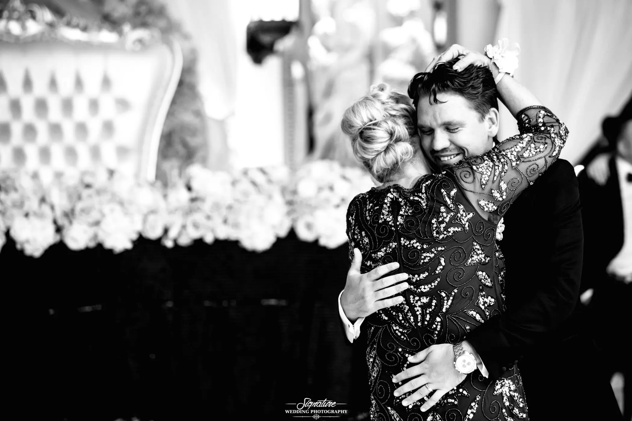 Mother and son dance groom's face black and white