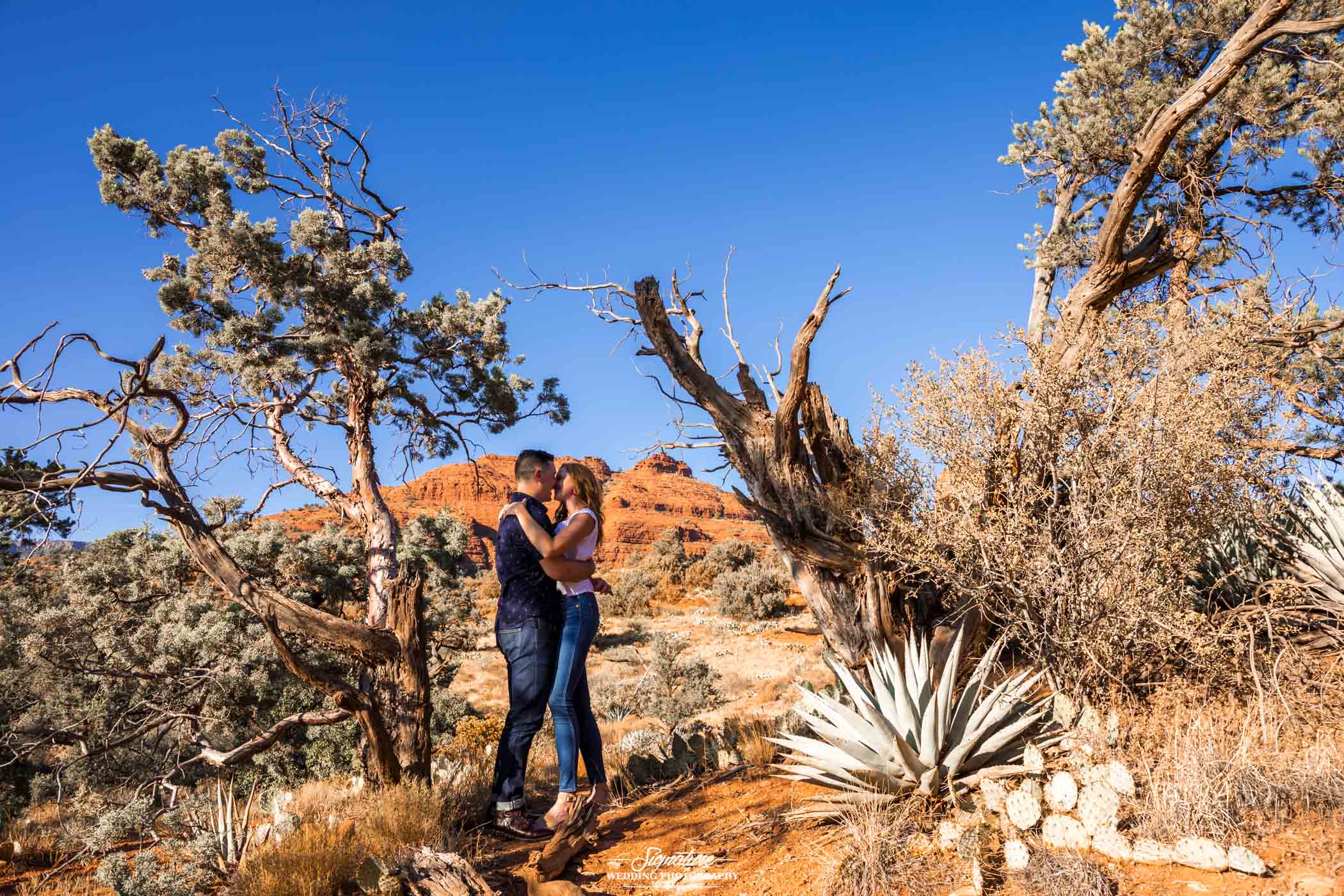 Couple embraced in open desert