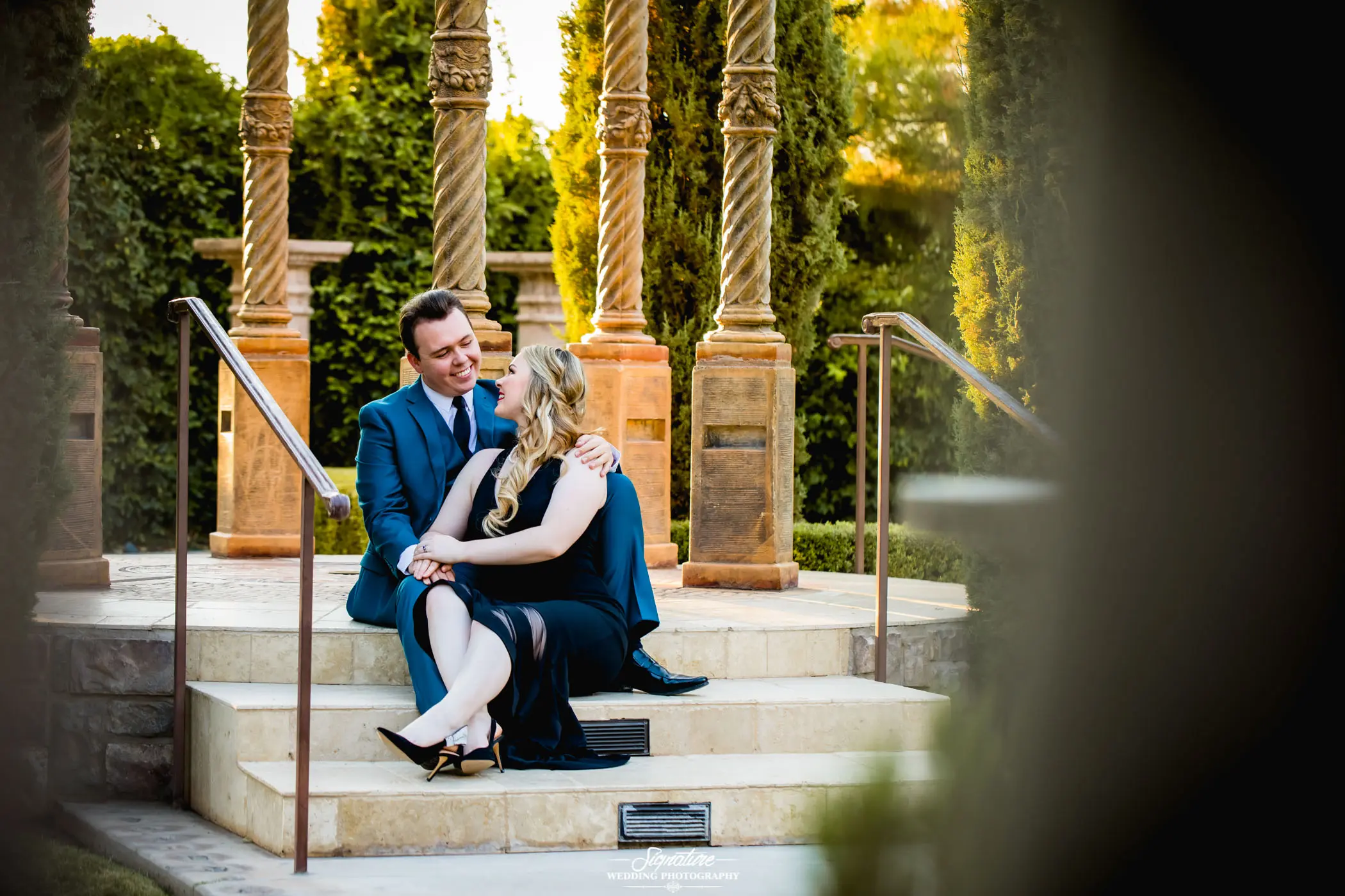 Couple looking at each other sitting on stairs
