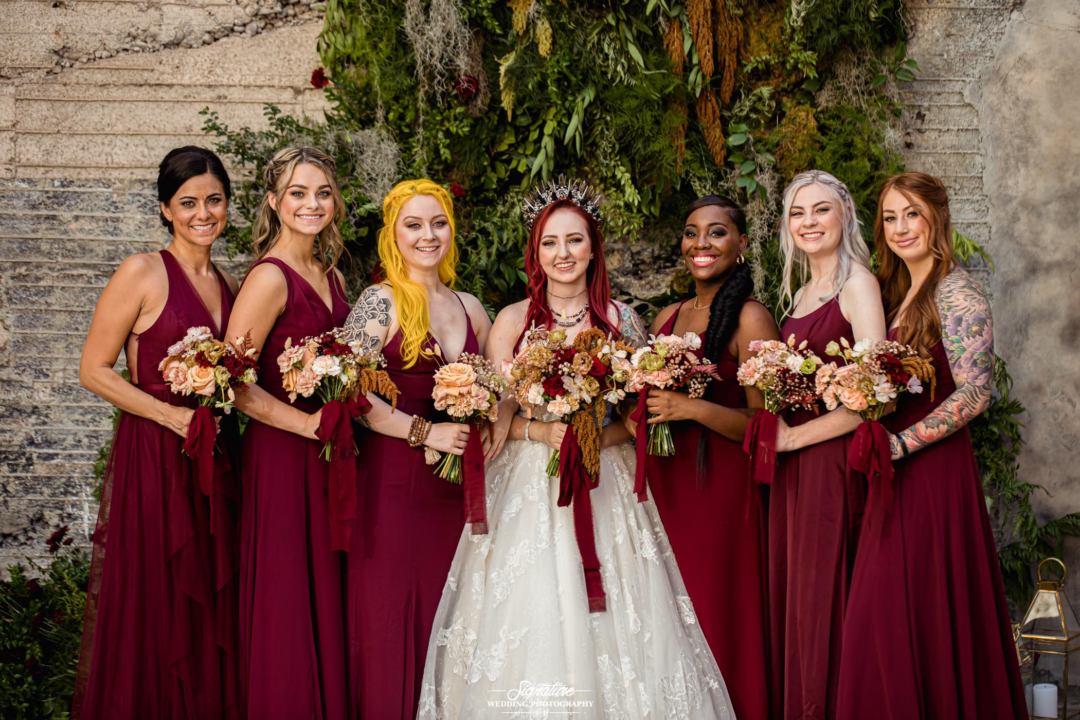 Bride with bridesmaids smiling