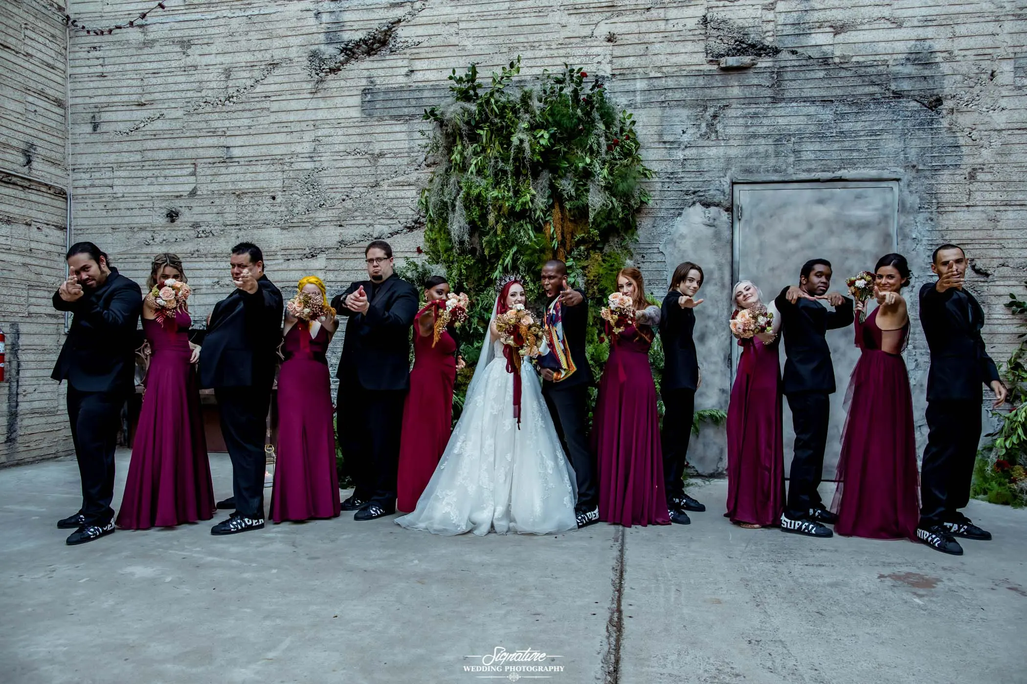 Wedding party fun pose finger guns