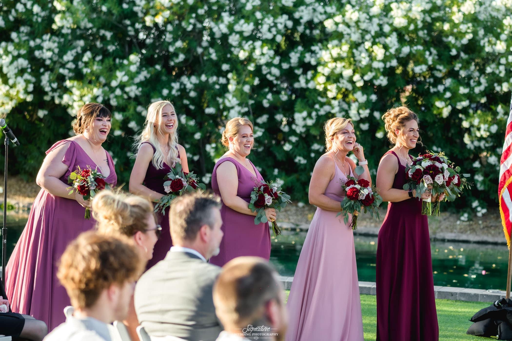 Bridal party smiling during ceremony candid