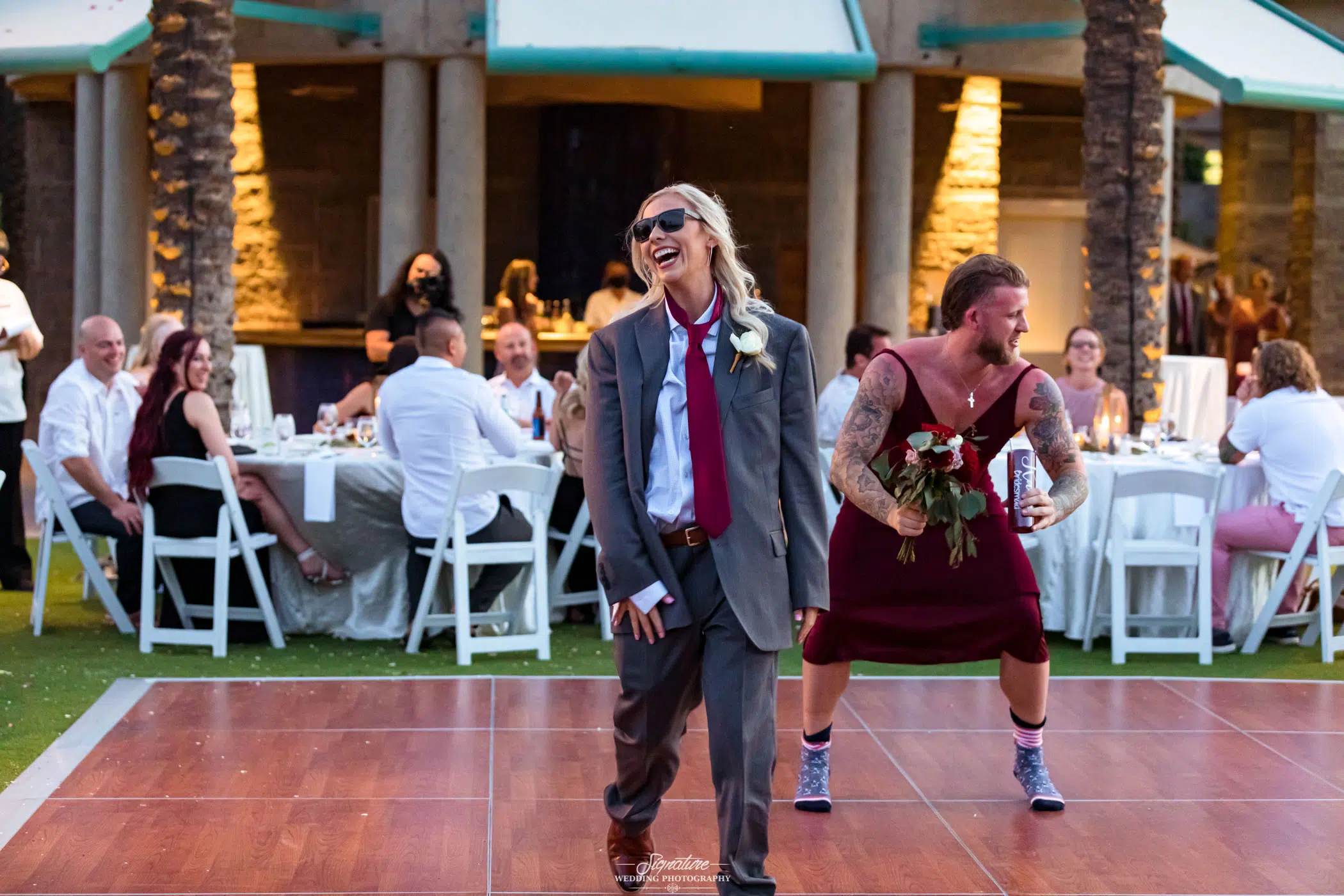 Wedding party in each other's outfits for grand entrance