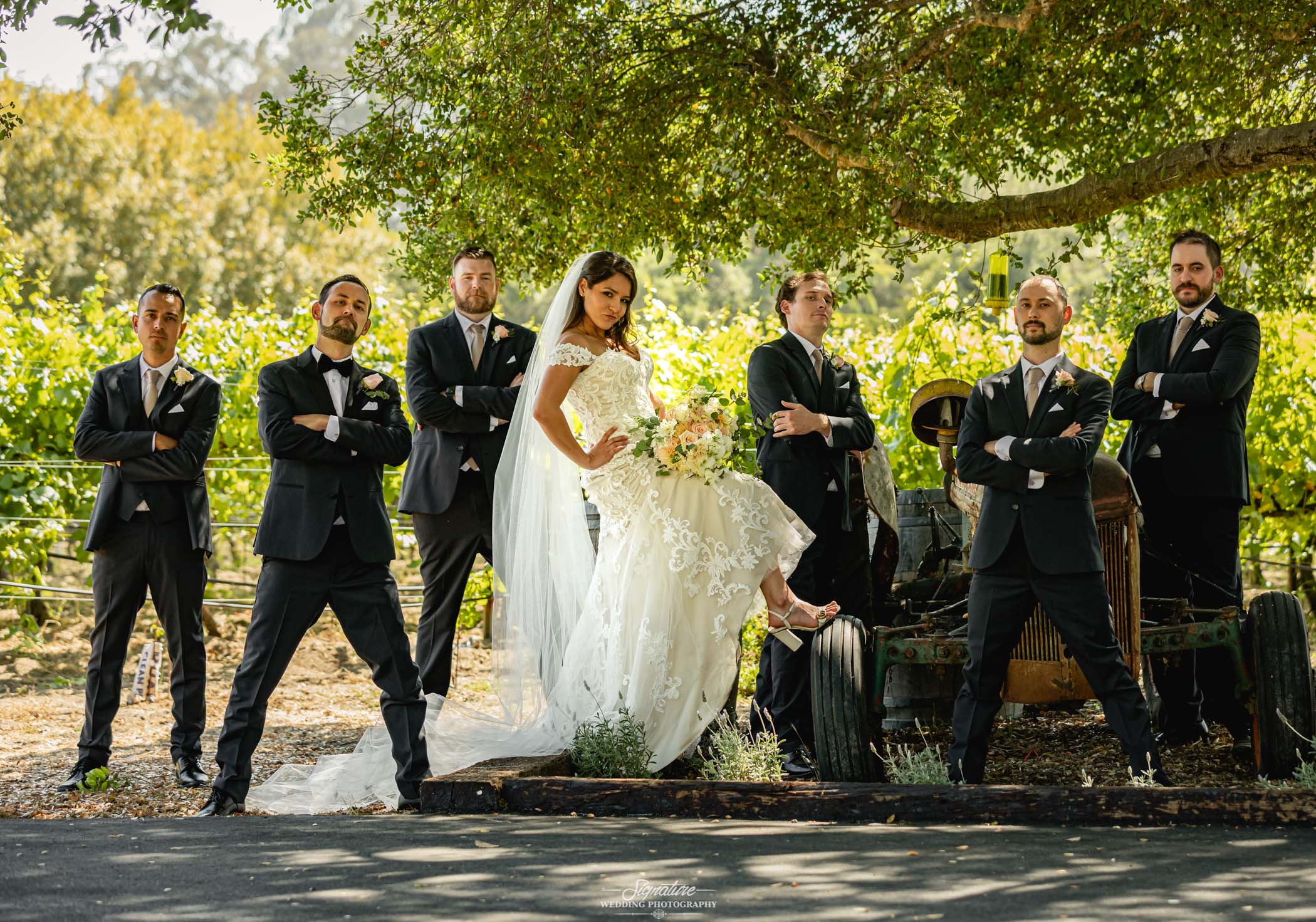 Bride with groomsmen outside