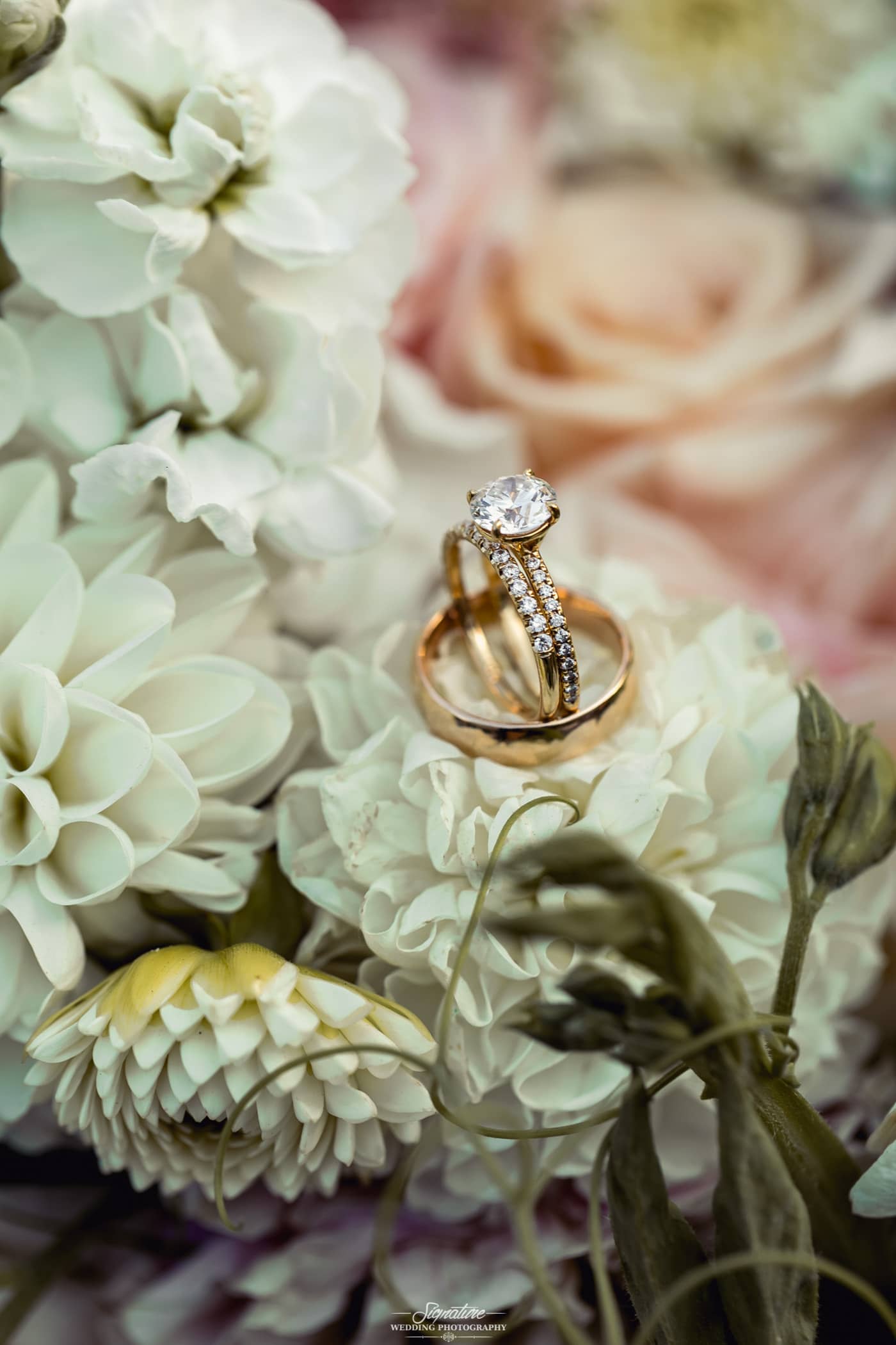 Wedding rings close up on bouquet