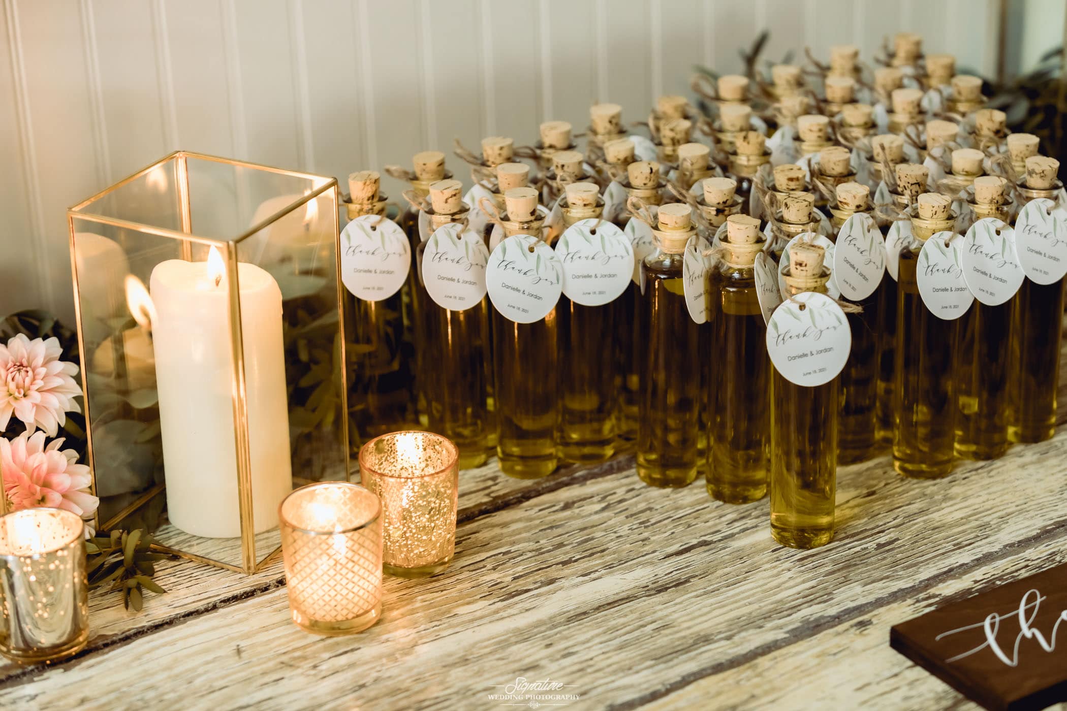 Wedding favor table with bottles and candles