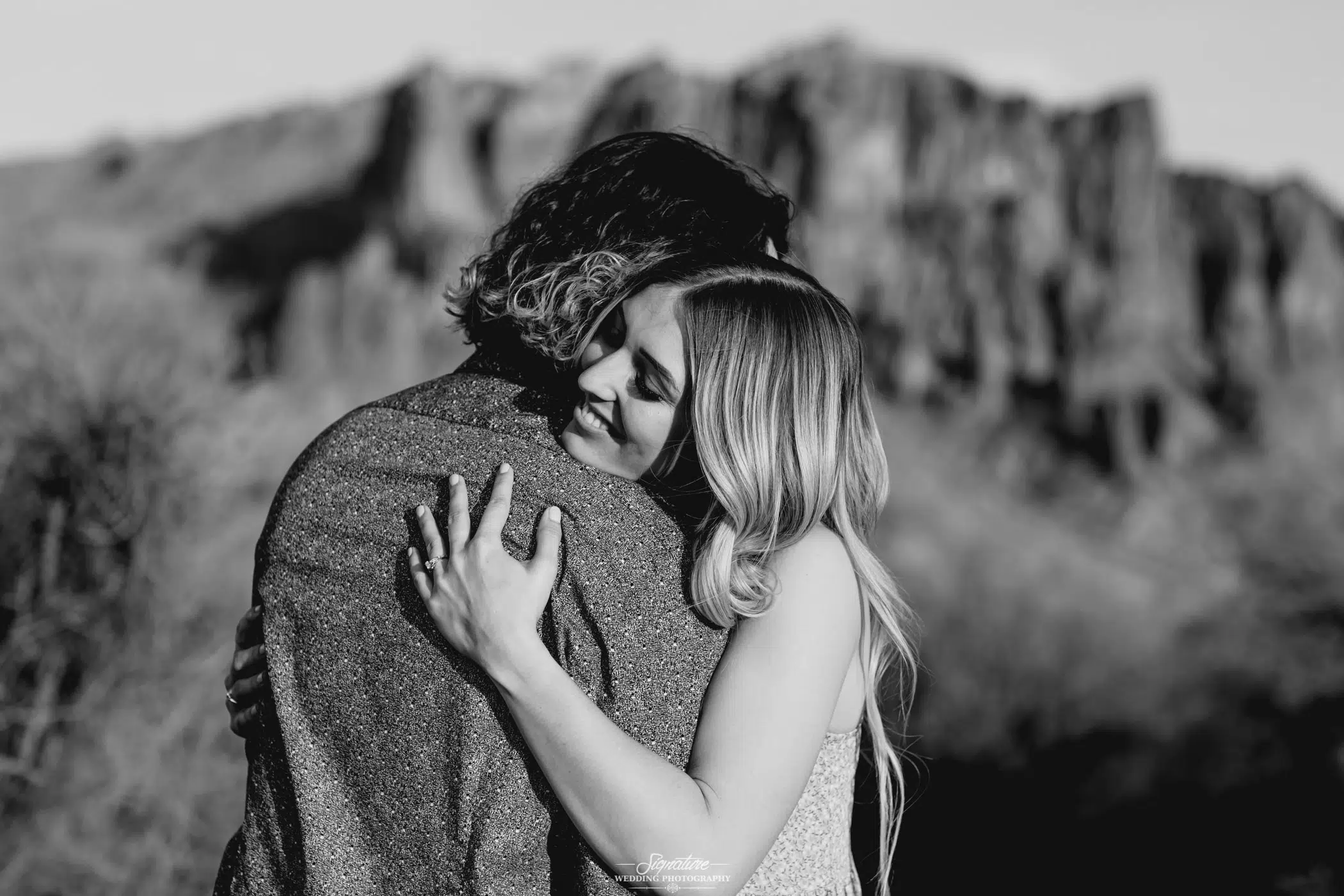 Hugging couple with smiling girl black and white