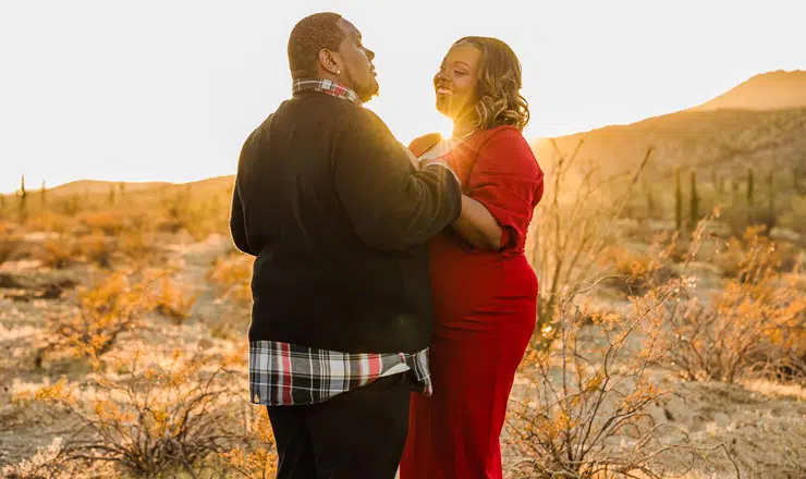 Couple face to face desert sunset