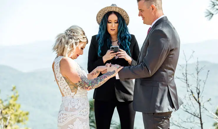 Bride and groom holding hands at ceremony