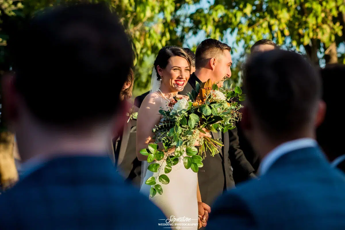 Over shoulder shot of bride and groom
