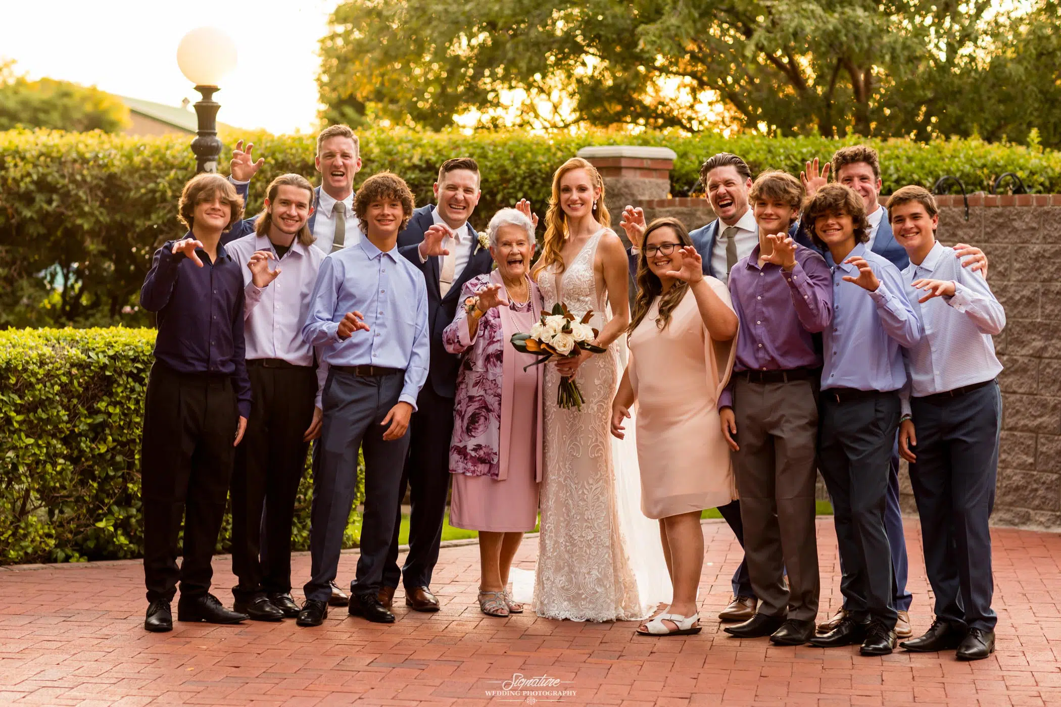 Bride and groom family picture claw pose