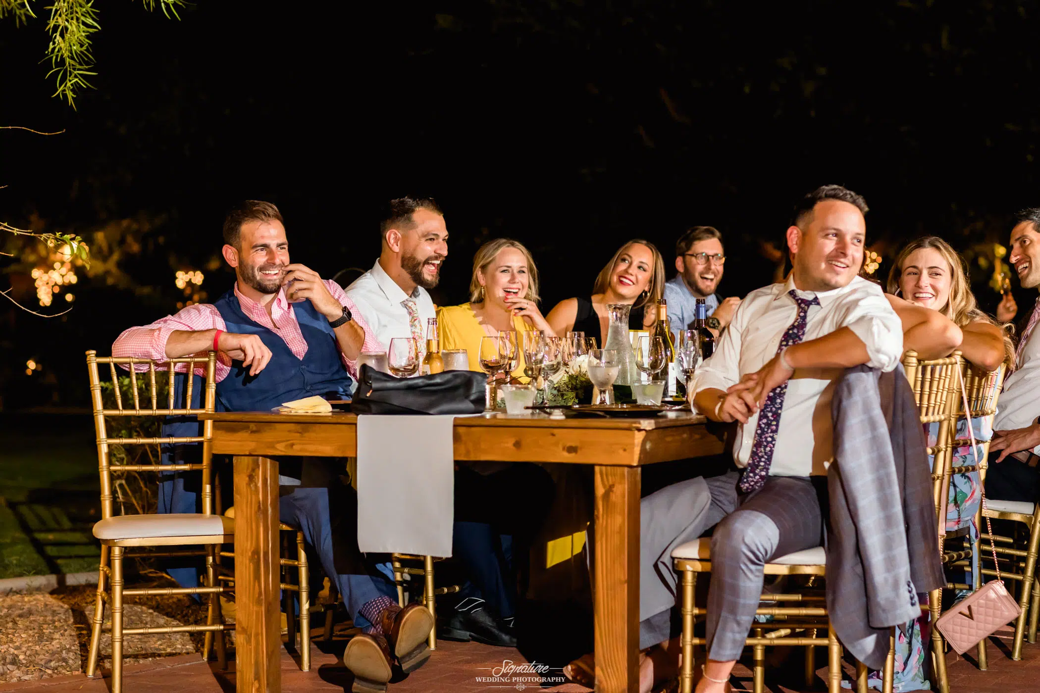 Wedding guests smiling at table candid