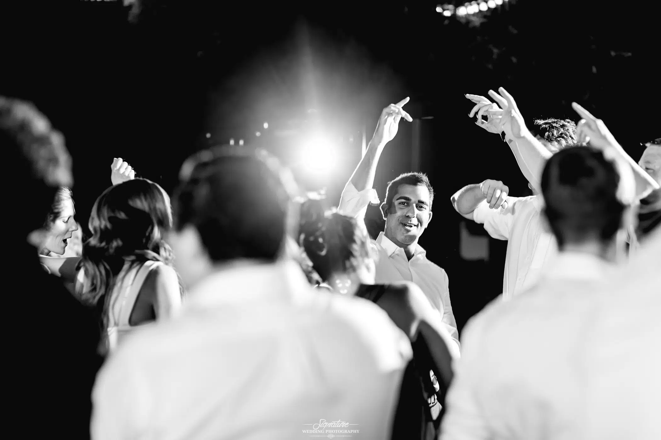 Wedding guests dancing black and white