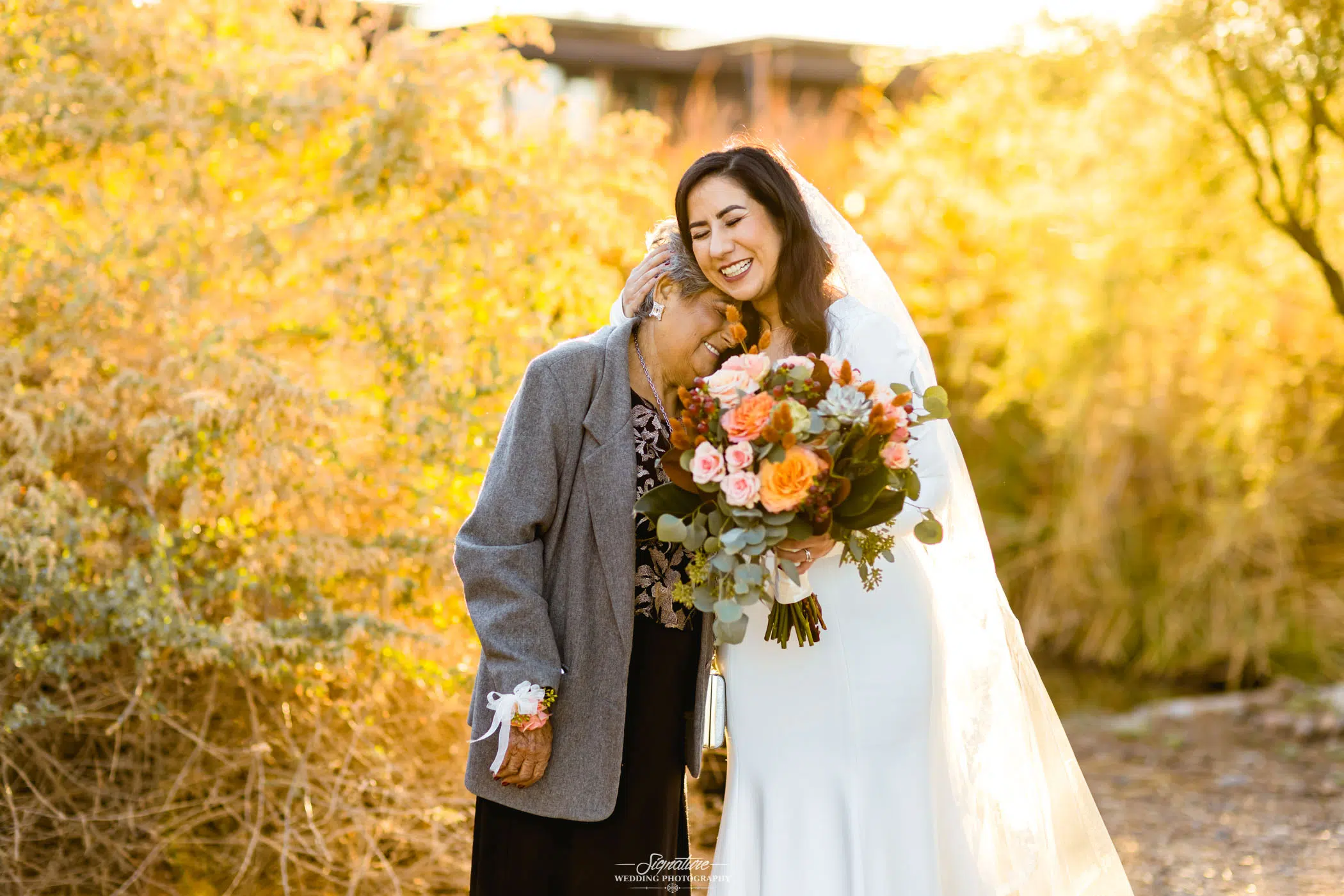 Bride hugging matriarch