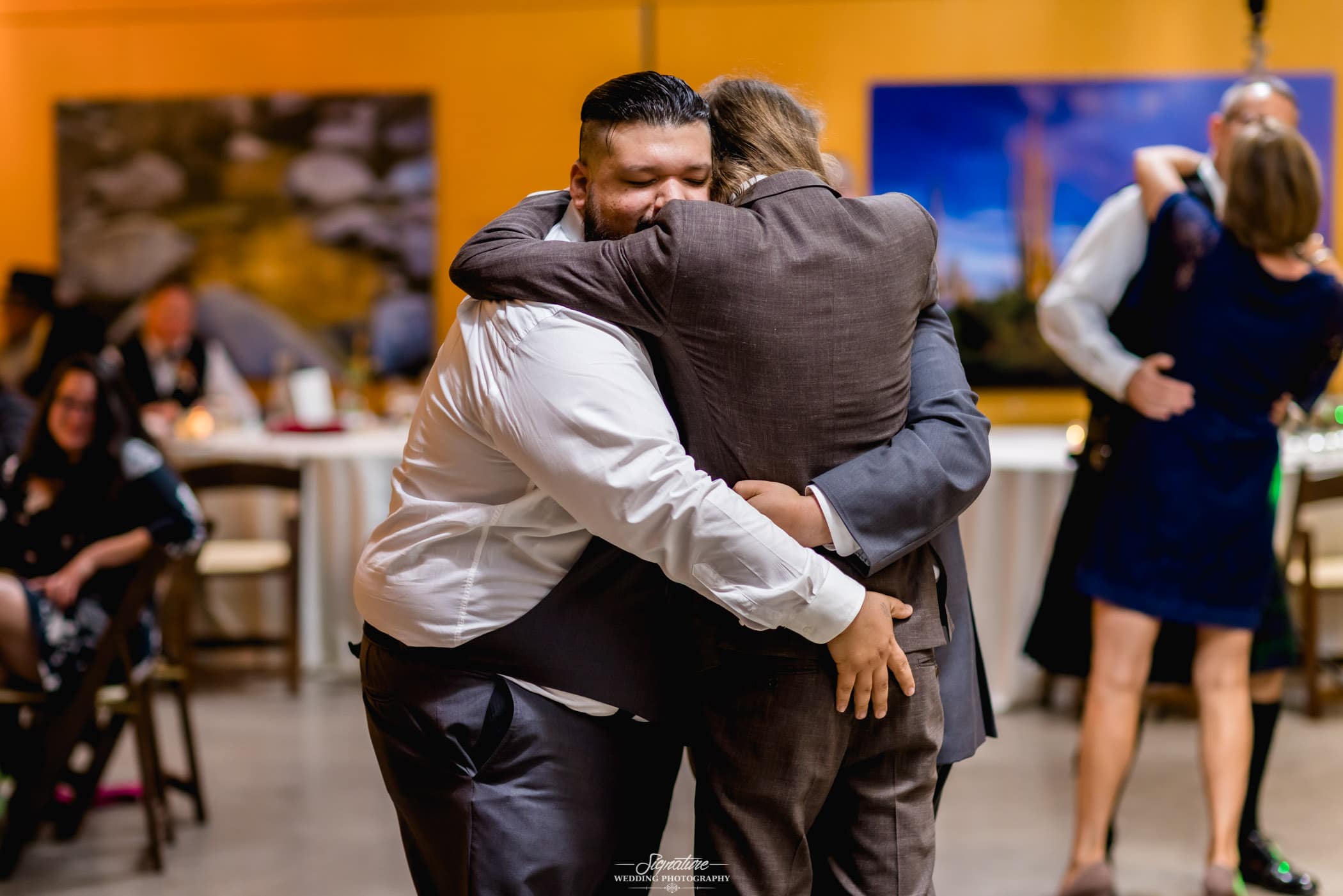 Group hug during reception