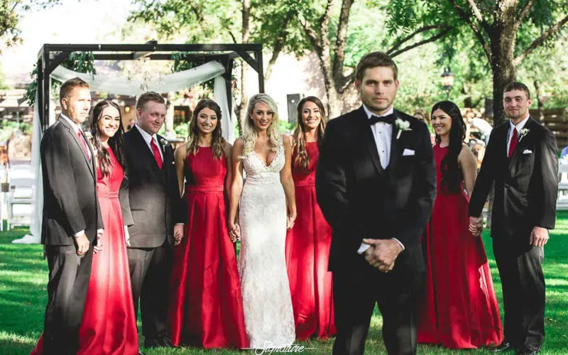 Wedding party behind groom for first look