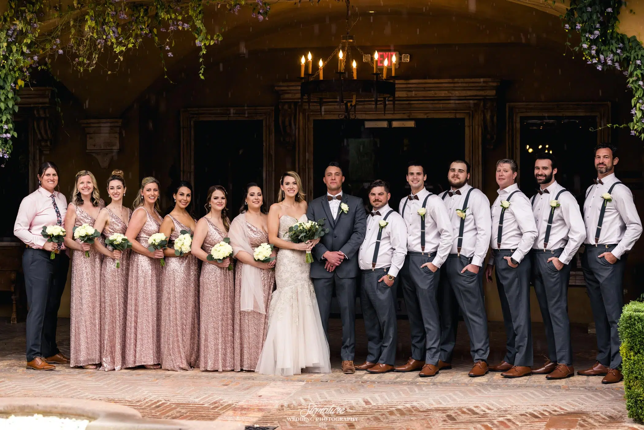 Wedding party smiling in corridor