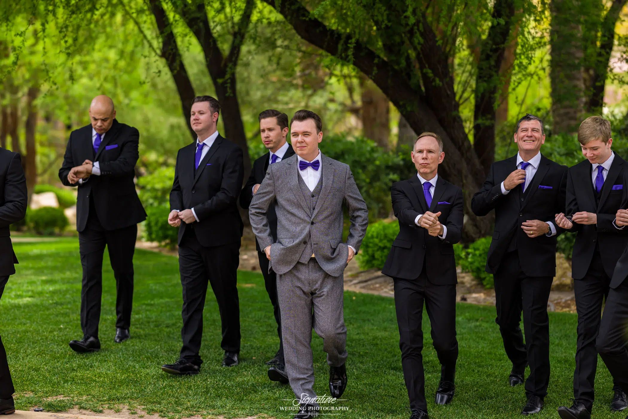 Groom walking with groomsmen