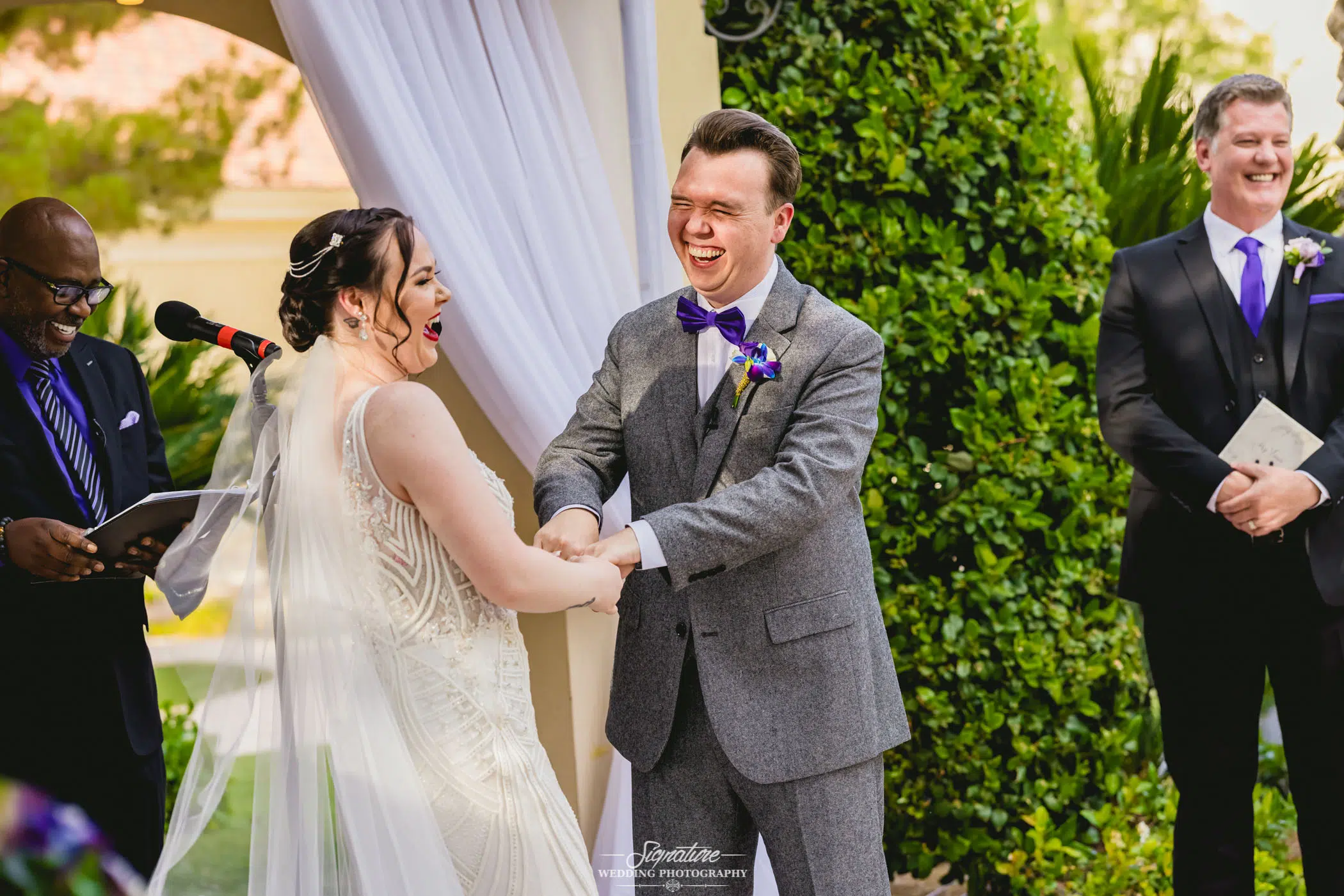 Bride and groom laughing during wedding ceremony