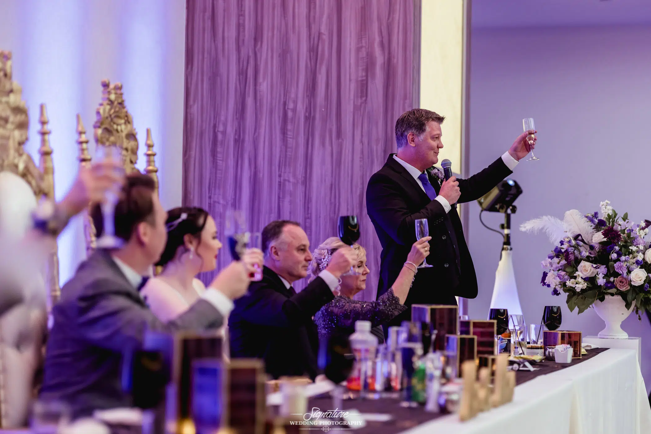Cheers at wedding reception