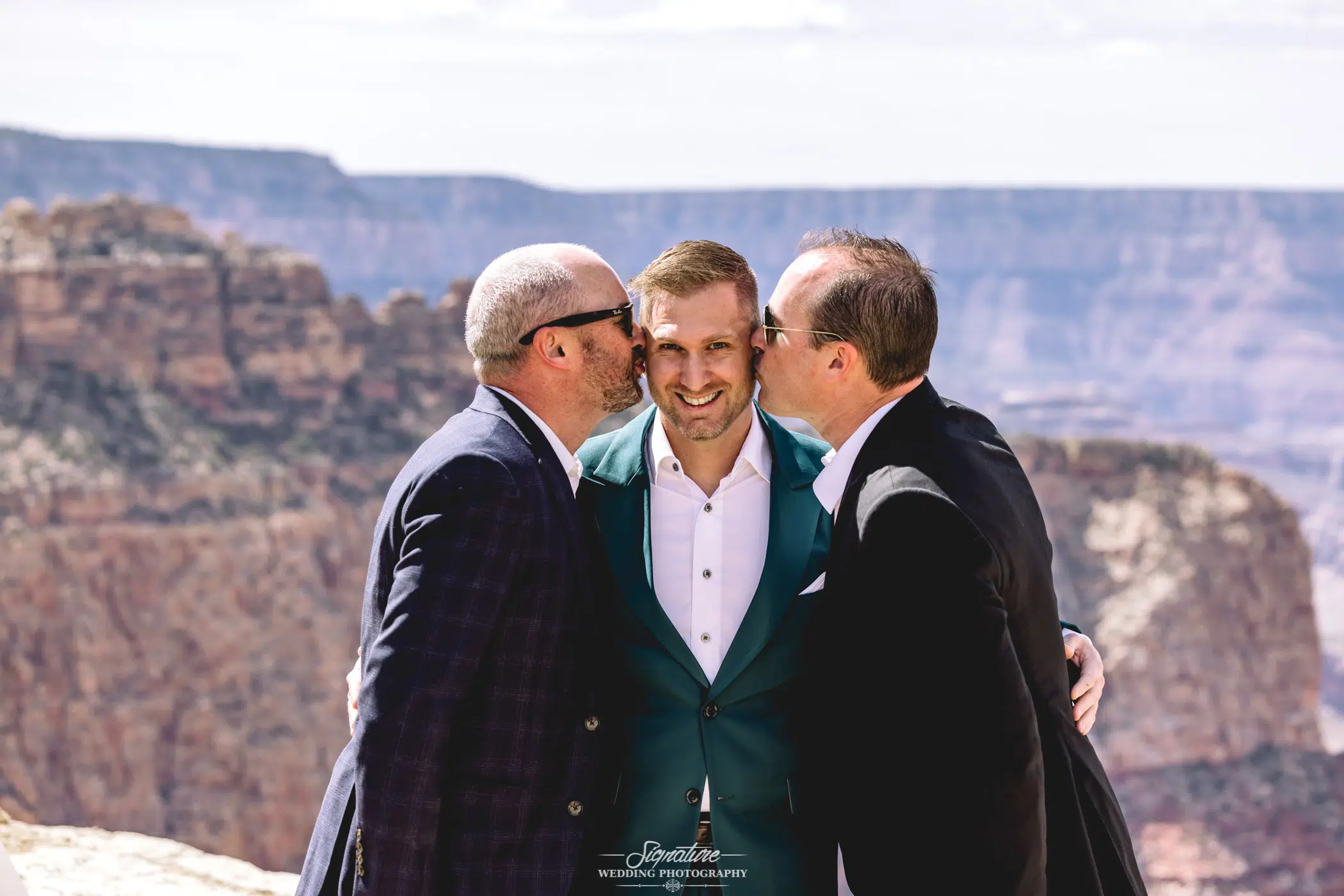 Patriarchs kissing groom on cheeks