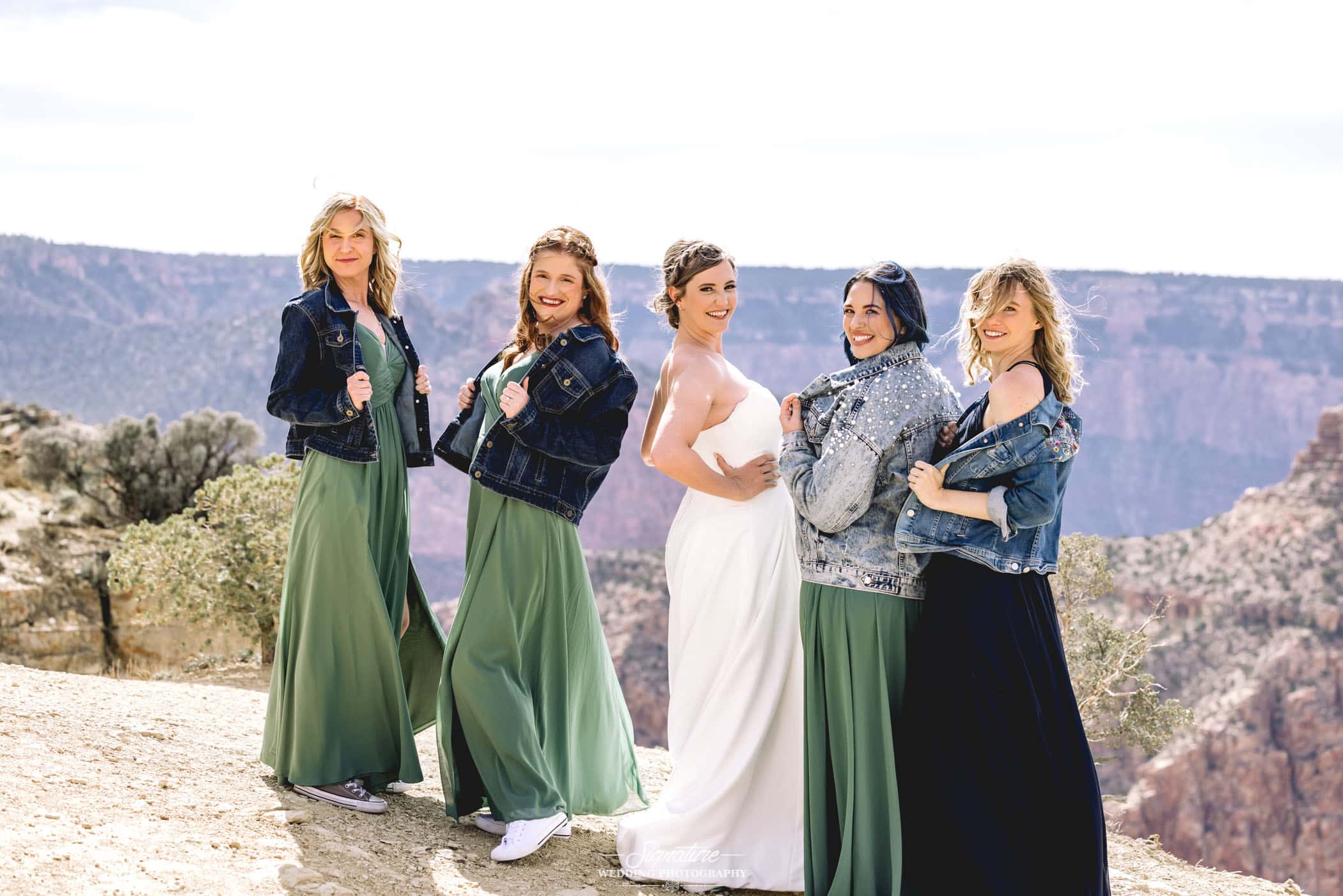 Bride with bridesmaids in denim jackets