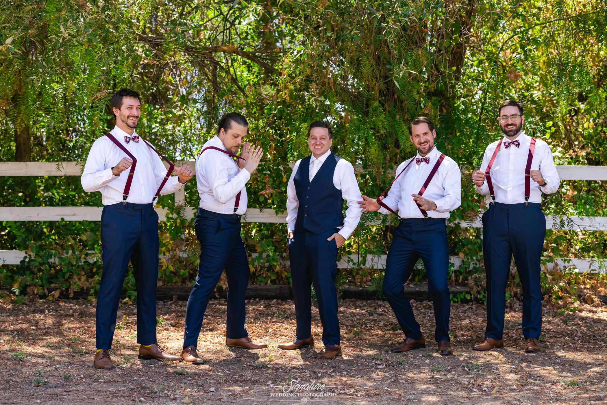 Groom with groomsmen in suspenders