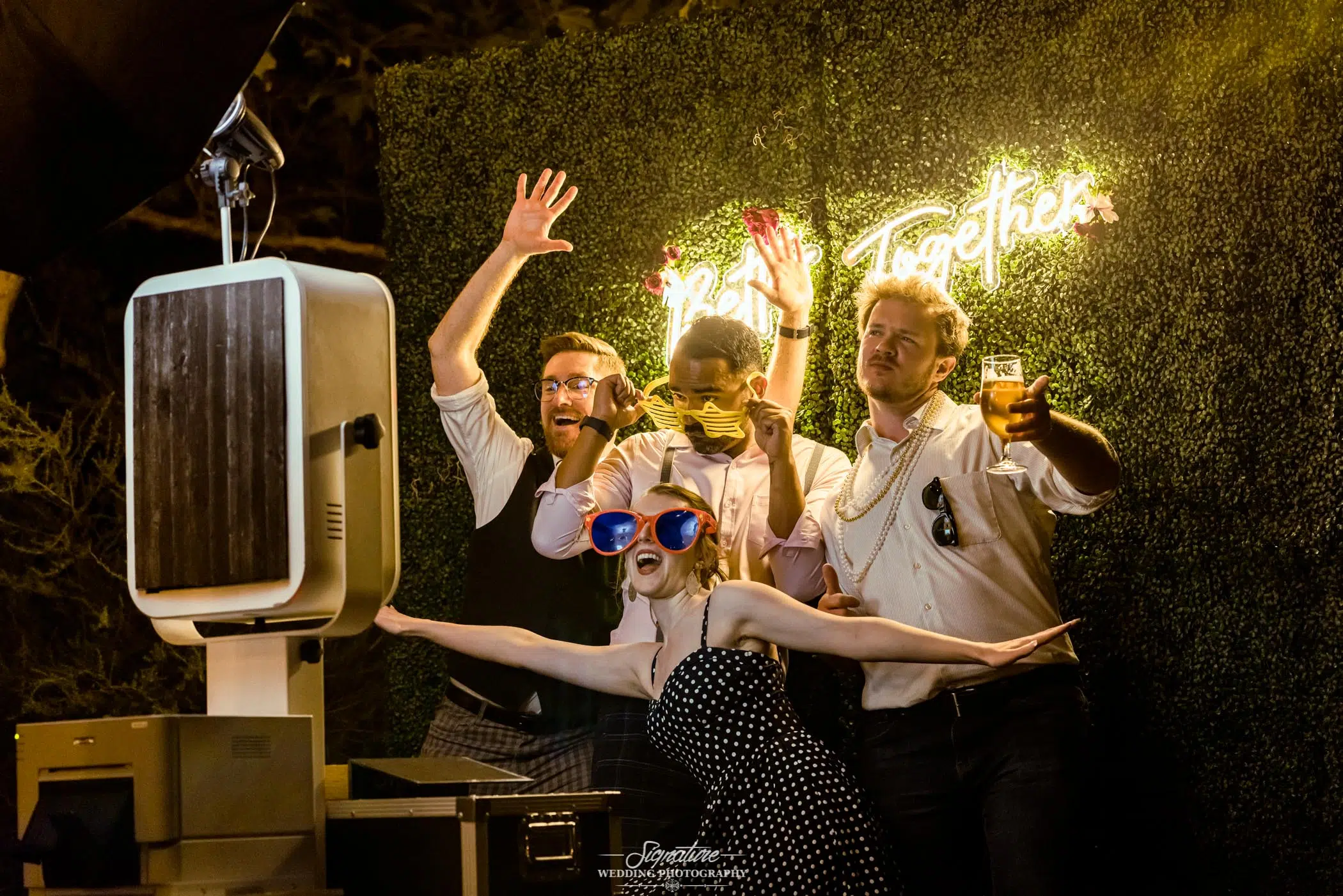 Candid group phot booth picture with props