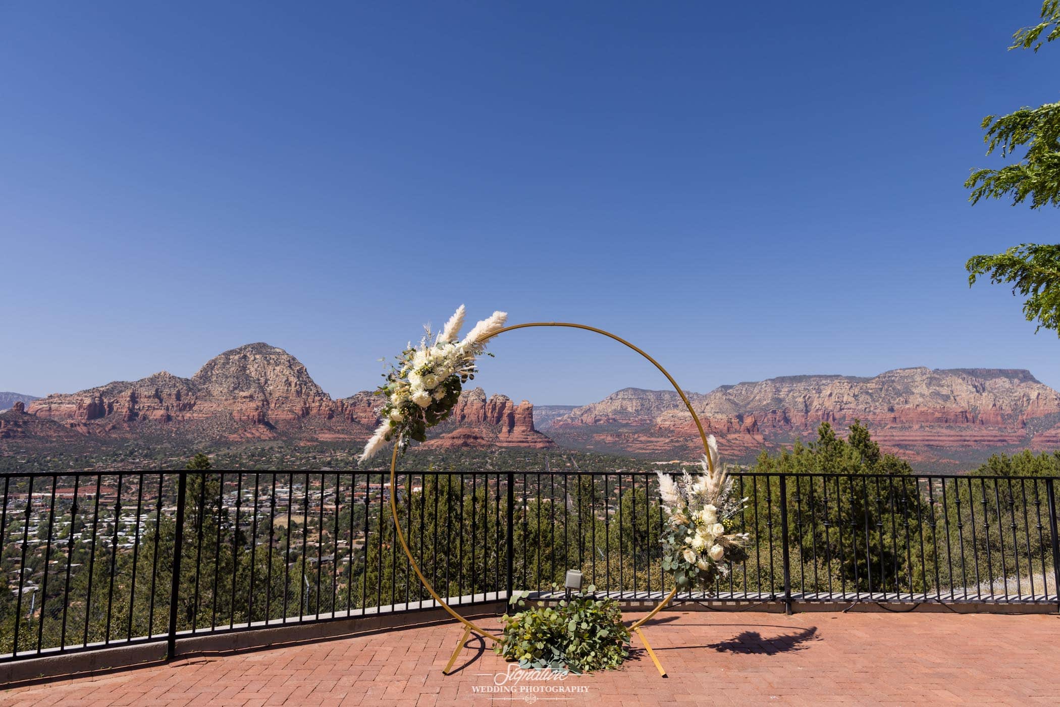 Wedding ring arch in front of desert mountains