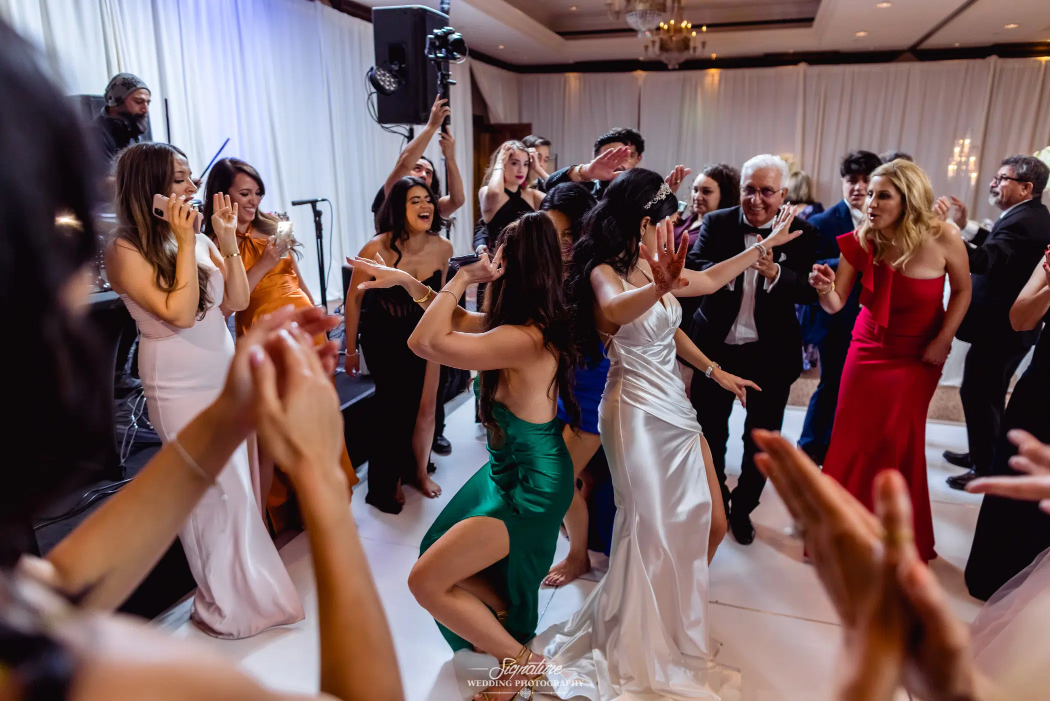 Bride dancing with wedding guests